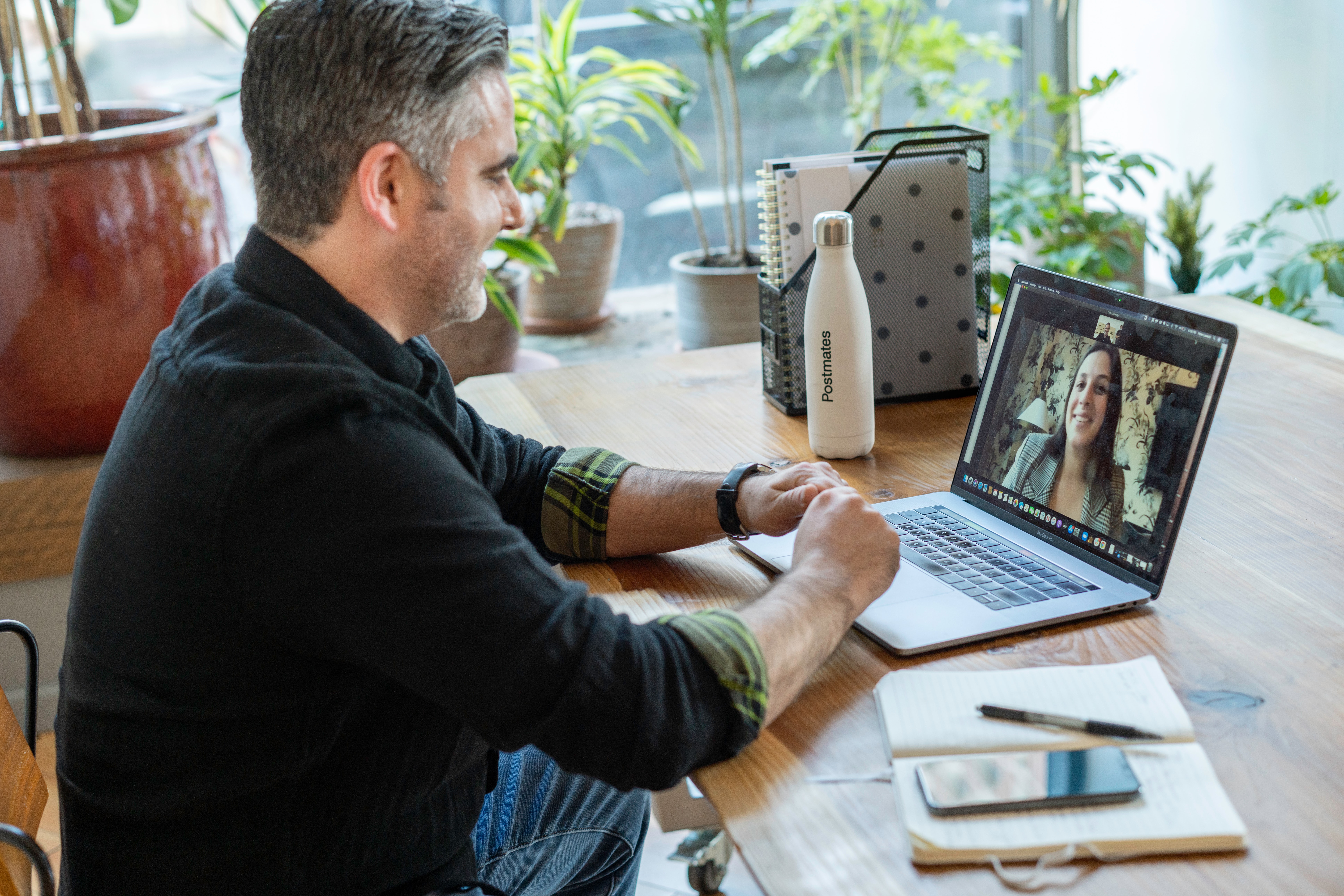 Man in a Zoom call with a woman